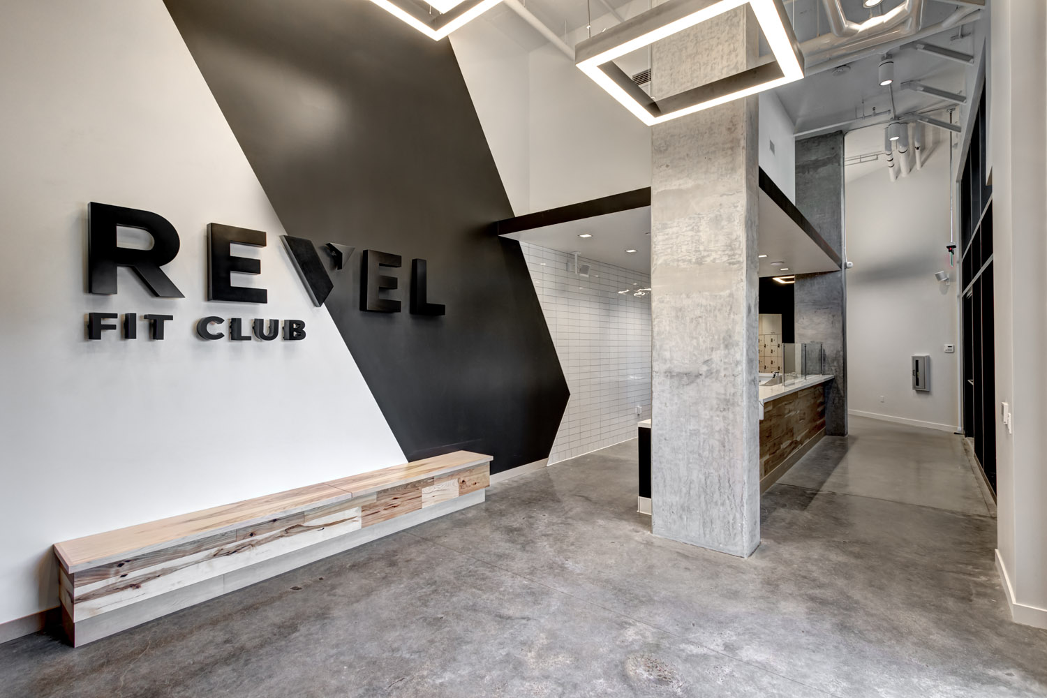 The REVEL Fit Club studio floor with club lighting